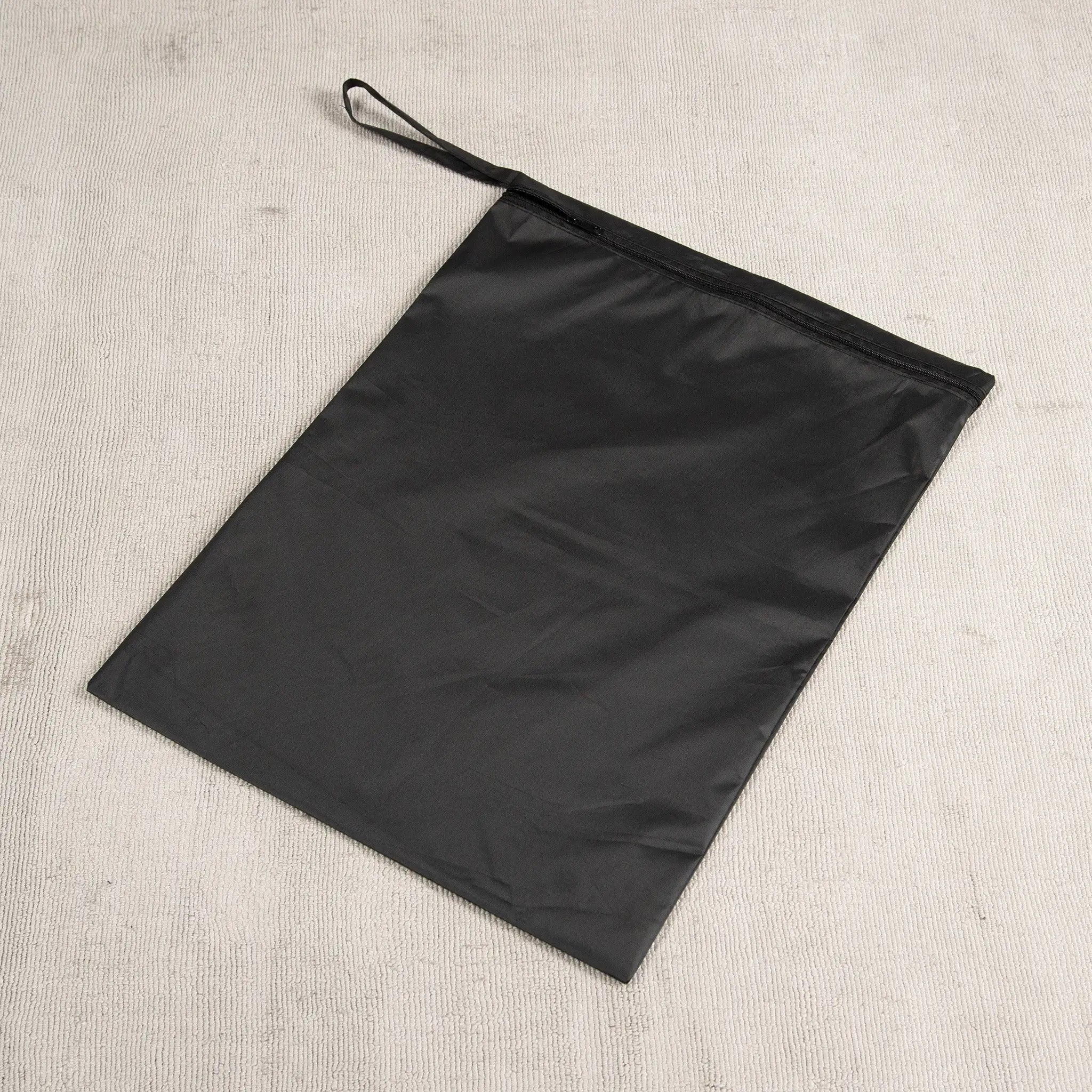 Black Staydry wet bag with a zip closure and wrist strap, designed for storing wet or soiled items. Made from waterproof, leak-proof fabric, this reusable bag is ideal for travel, gym, baby nappies, swimsuits, and incontinence products. A durable and eco-friendly alternative to plastic bags, keeping moisture and odours contained.
