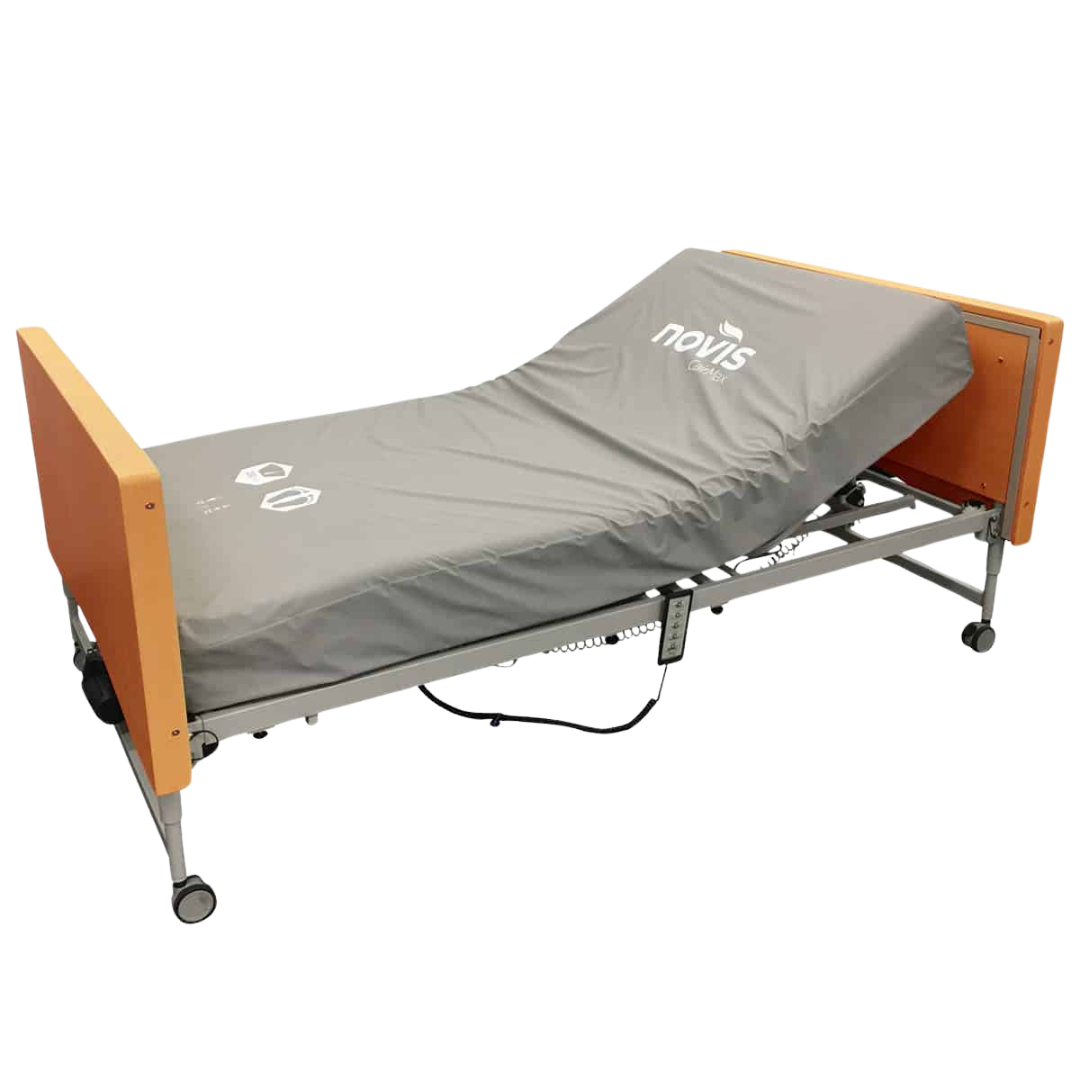 BetterLiving Community Bed with electric height adjustment, timber-look head and footboards, and optional side rails, designed for aged care, disability support, and home healthcare environments.